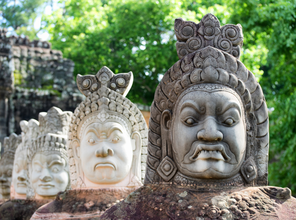 statue heads in a line