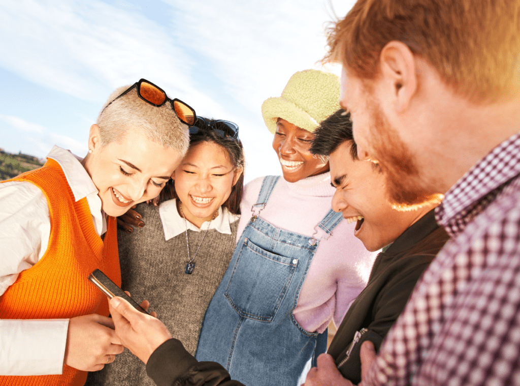 group of friends looking at a phone