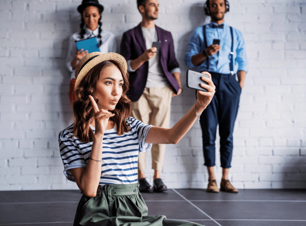 friends in a group taking selfies