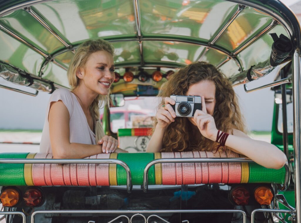 Two women in a train taking a picture